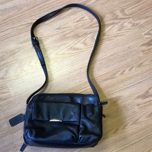 Genuine leather purse with man made trim